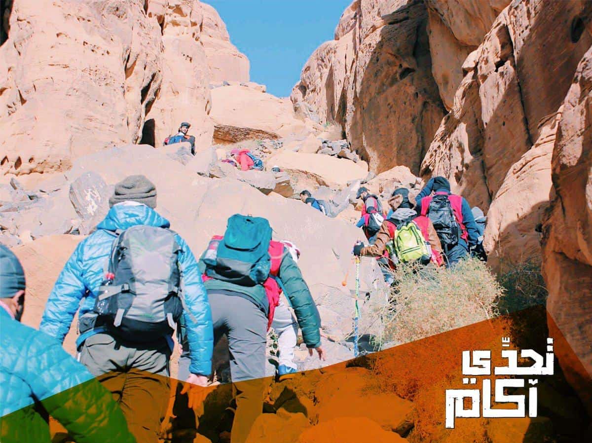 Students gathered under the night sky of AlUla during the Akkam program